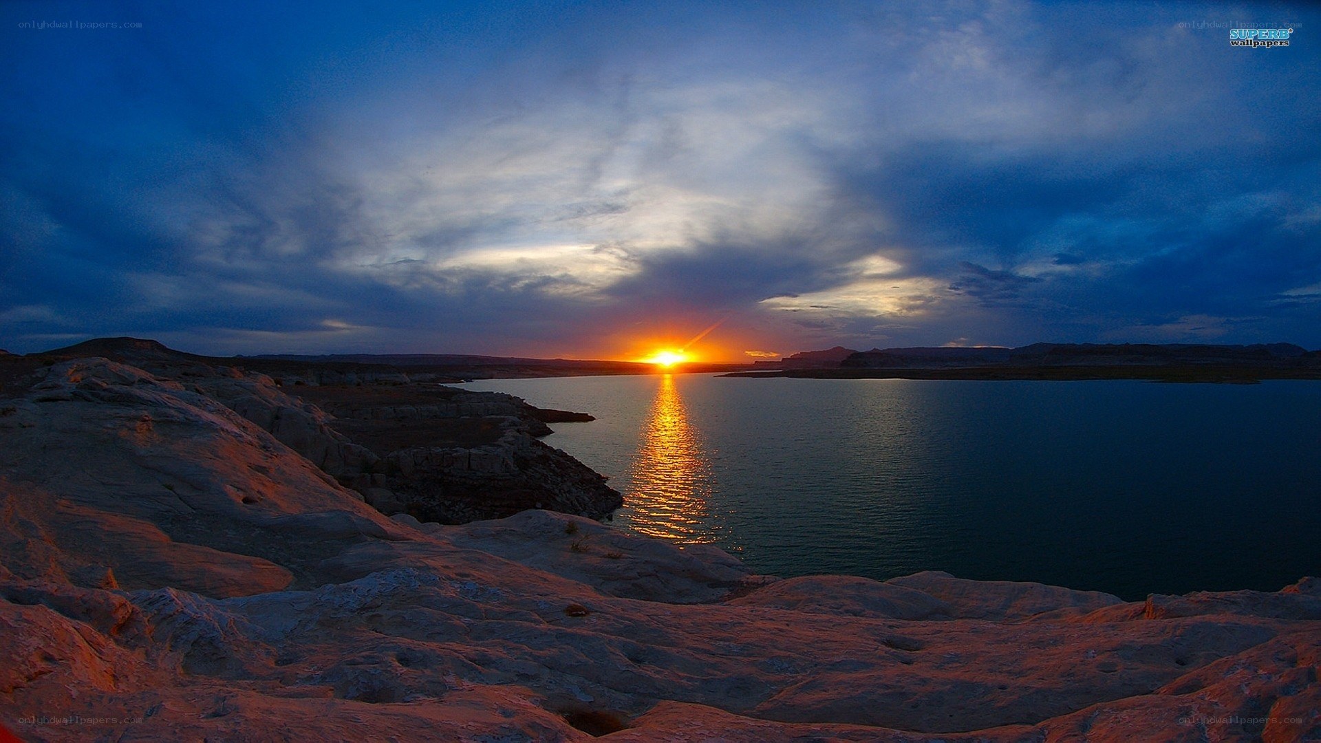 sunset over a desert lake