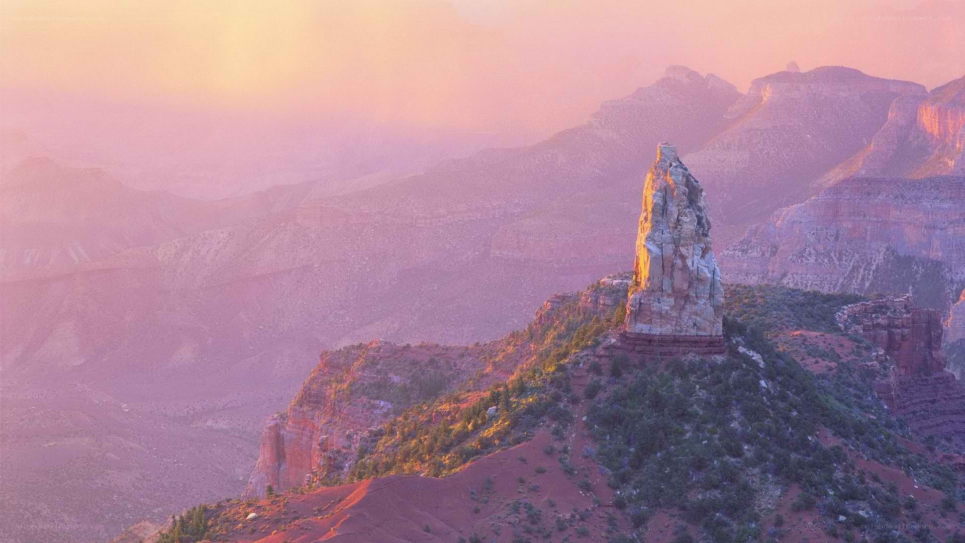 Sunset over a desert rock formation