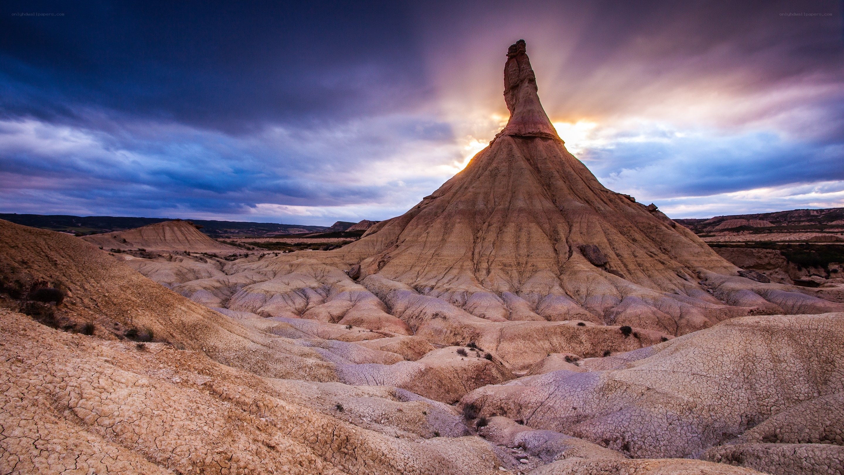 Sunset over a desert rock formation
