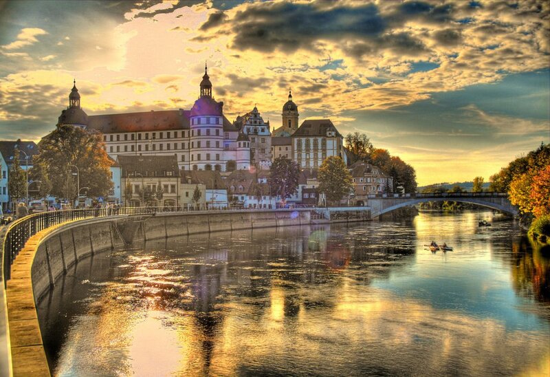 Sunset over a European river city