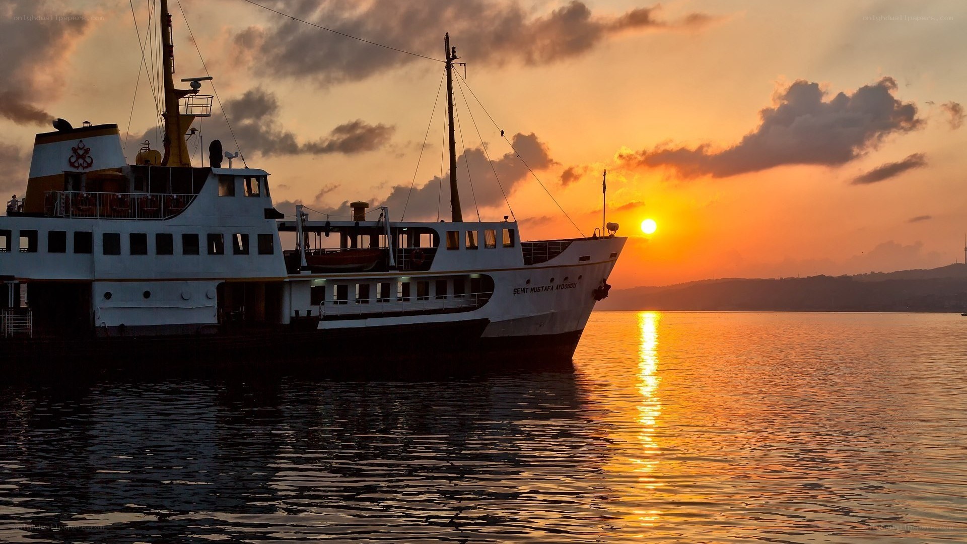 Sunset over a ferry at sea