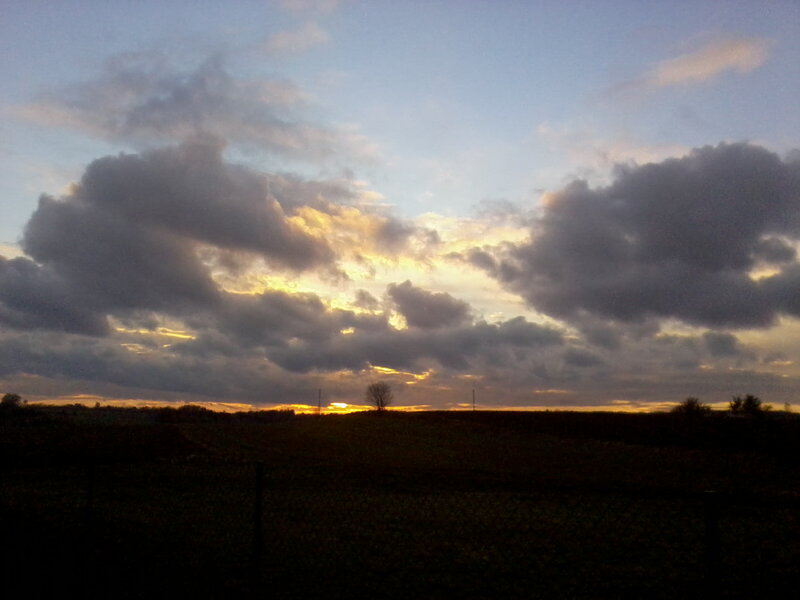 Sunset over a Field — Blue, Dramatic, Photograph