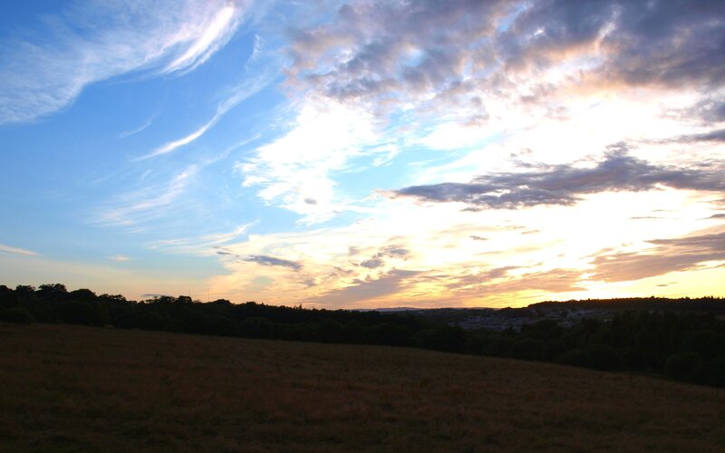 Sunset over a Field — Blue, Serene, Photograph, Sky, Clouds