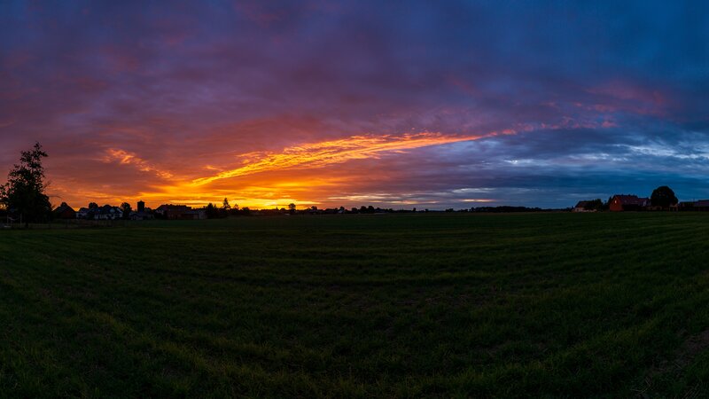 Sunset over a Field — Orange, Dramatic, Photograph, Sky, Village