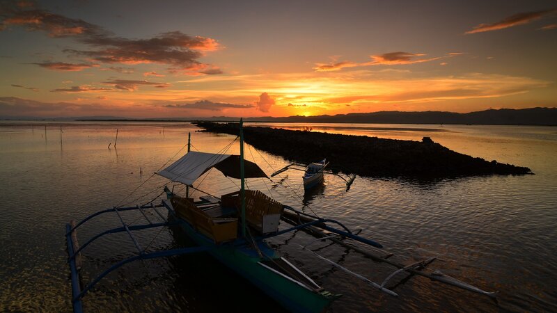 Sunset over a fishing boat