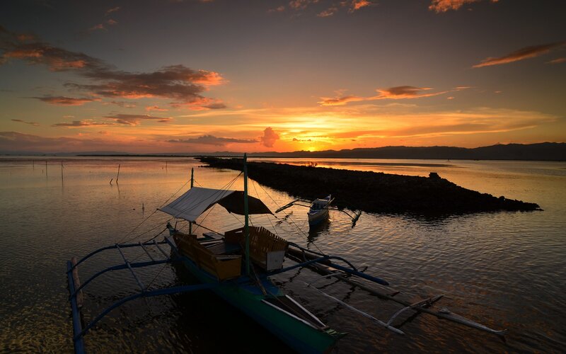 Sunset over a fishing boat