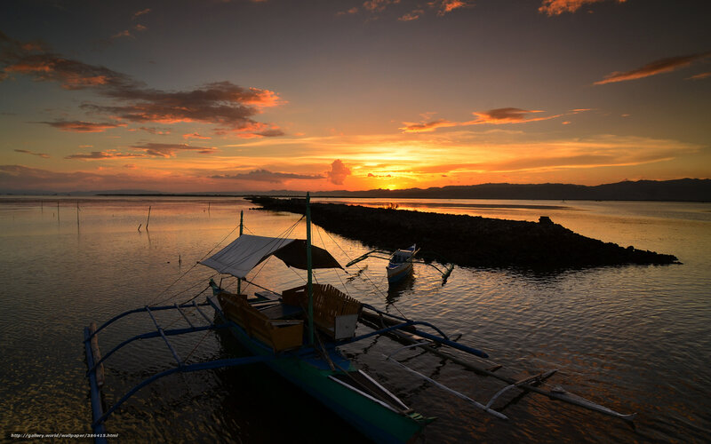 Sunset over a fishing boat