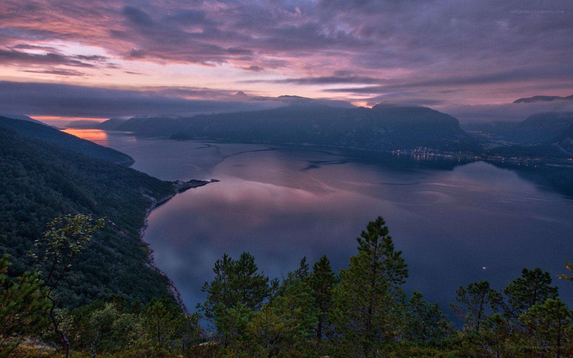Sunset over a fjord landscape