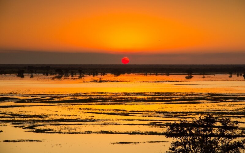 Sunset over a flooded plain