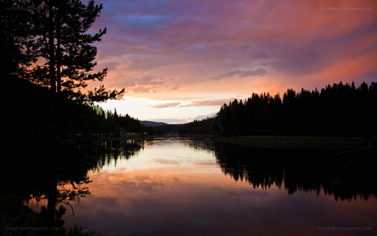 Sunset over a forest lake