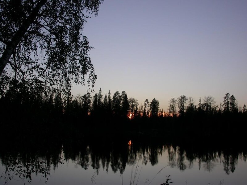 Sunset over a forest lake