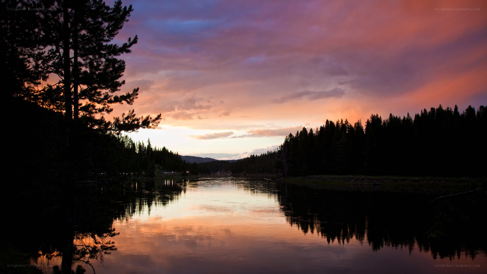 sunset over a forest lake