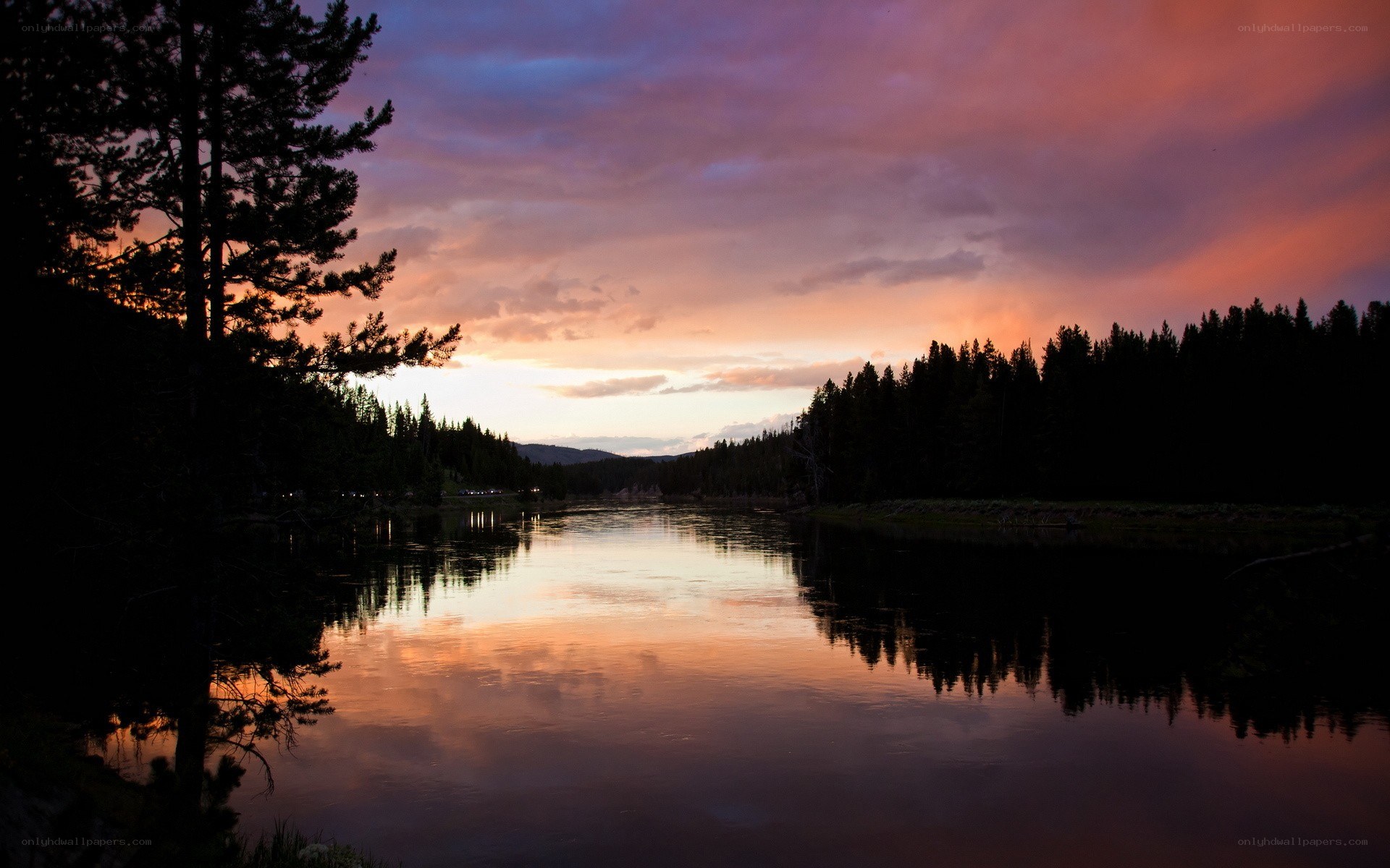 sunset over a forest lake
