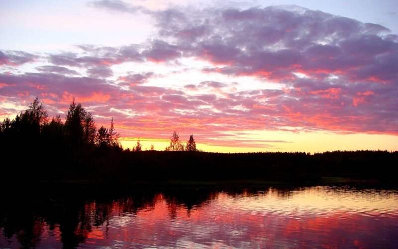 Sunset over a forest lake