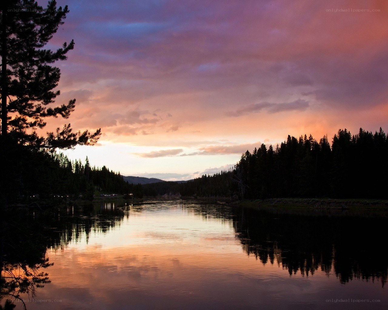 sunset over a forest lake