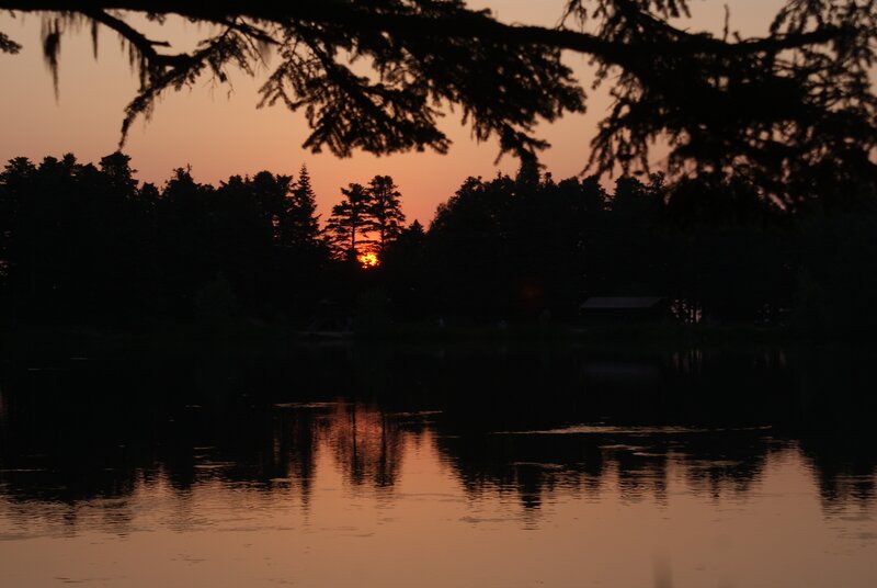 Sunset over a forest lake