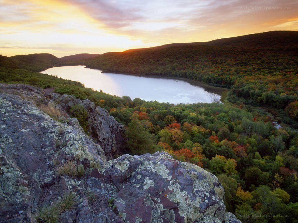 sunset over a forest lake