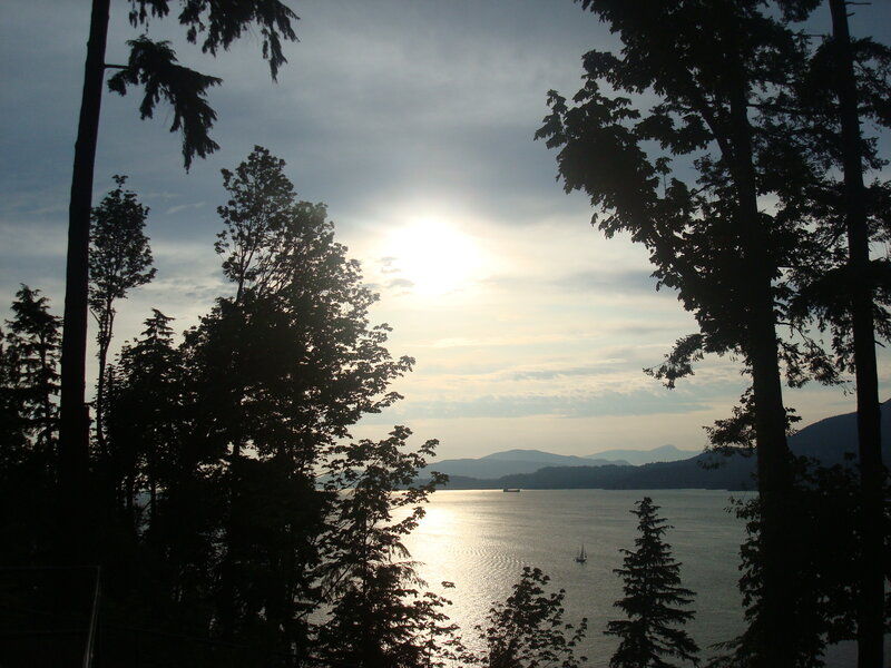 Sunset over a forested bay