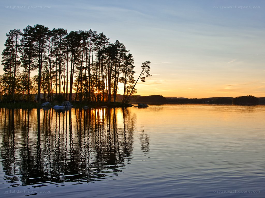 Sunset over a forested island