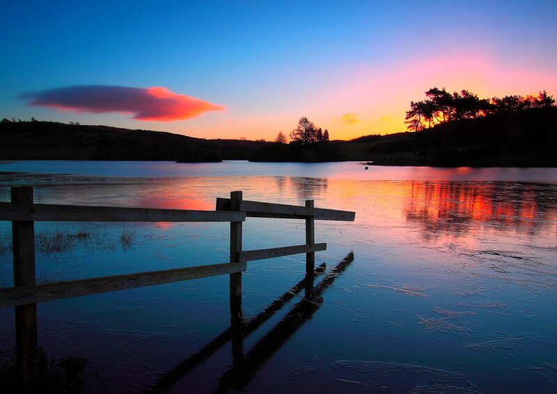 sunset over a frozen lake