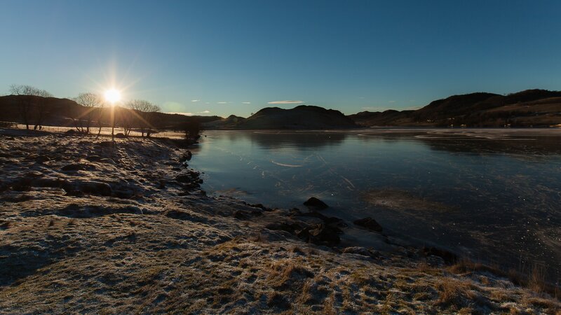 Sunset over a frozen lake
