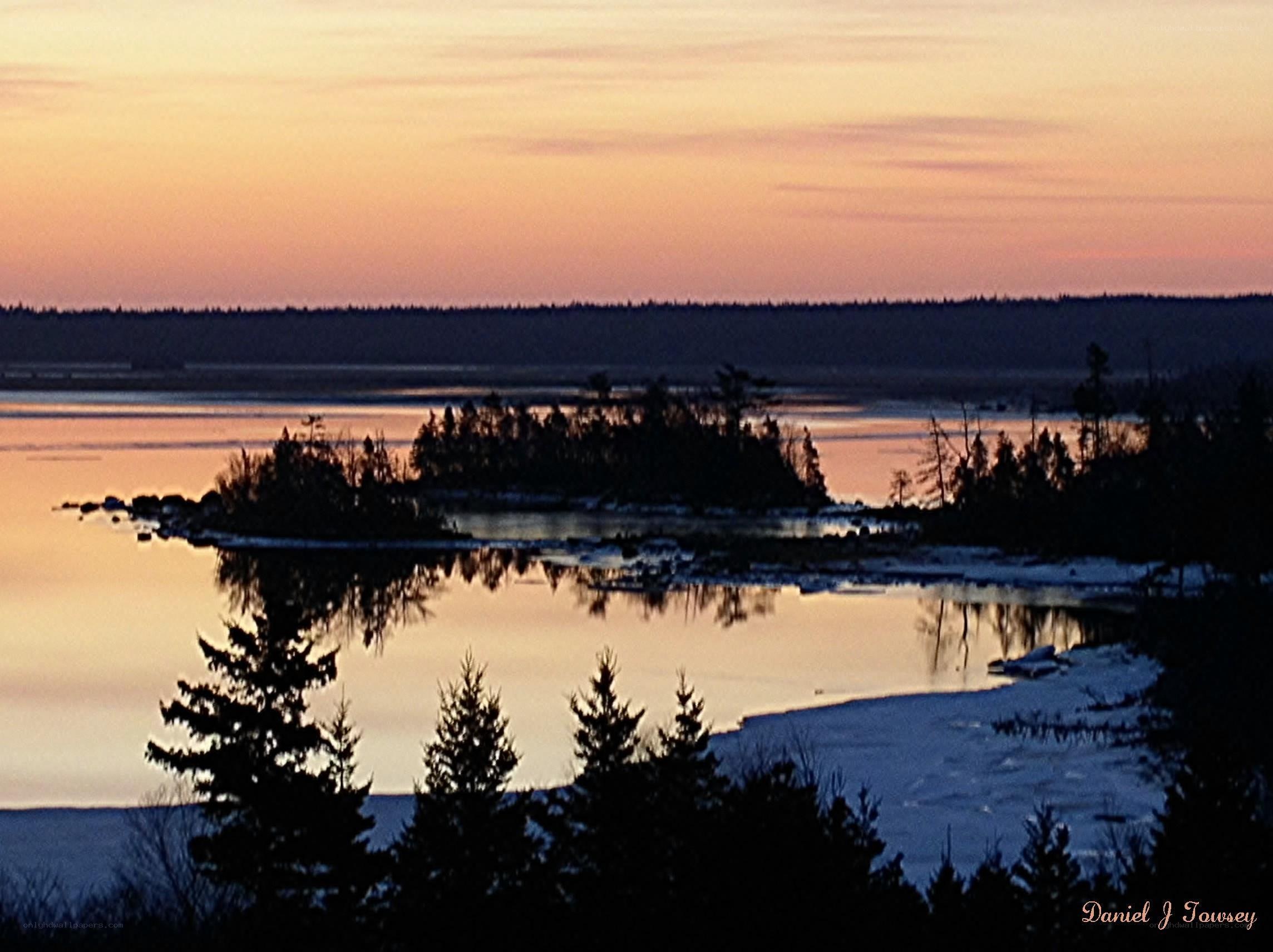 sunset over a frozen lake