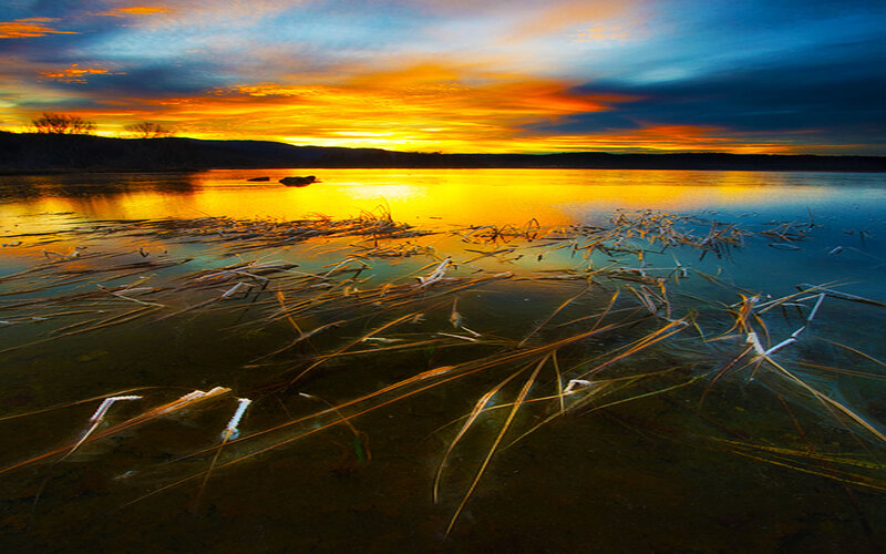 Sunset over a frozen lake
