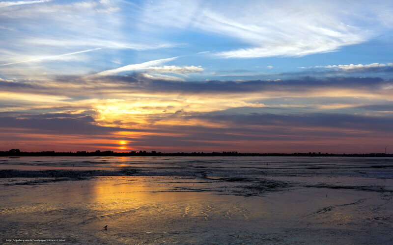 Sunset over a frozen lake