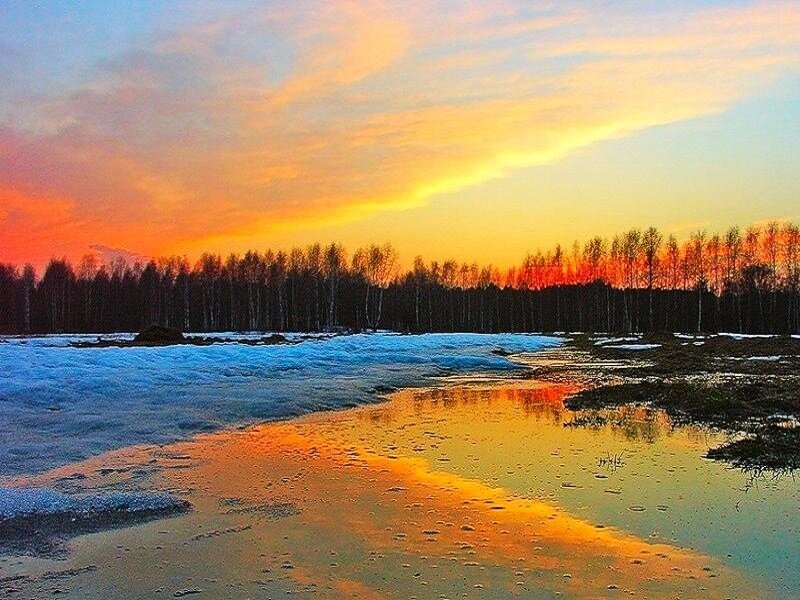 Sunset over a frozen river