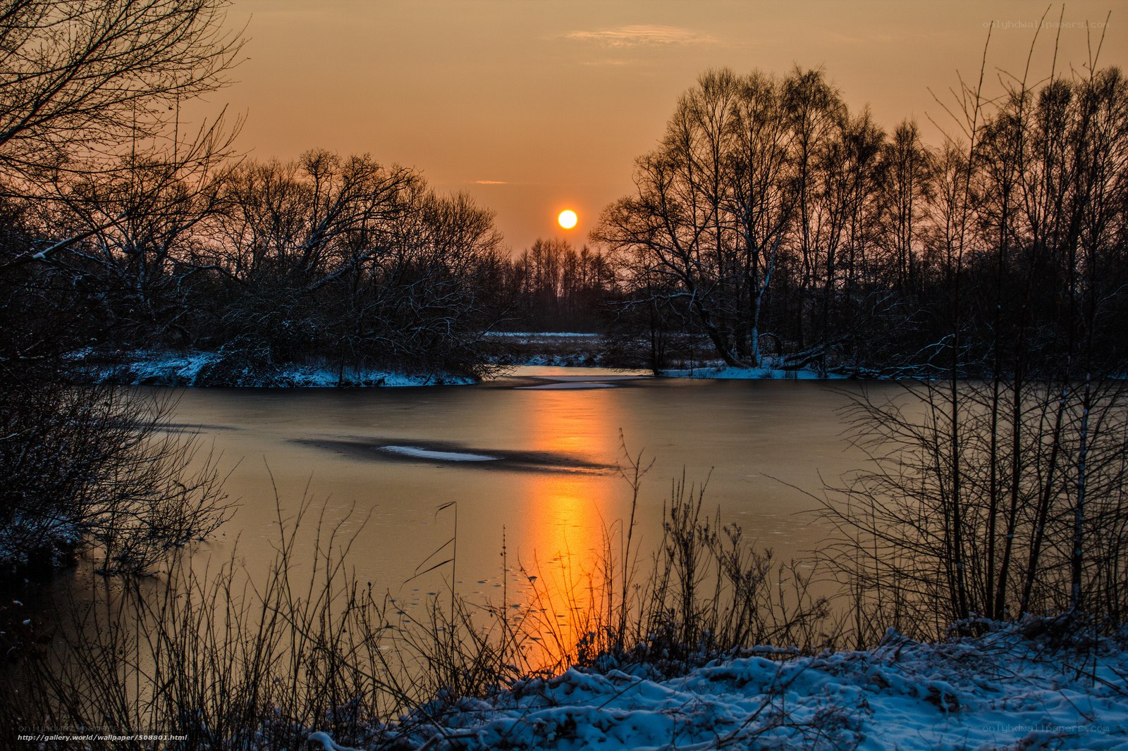 Sunset over a frozen river