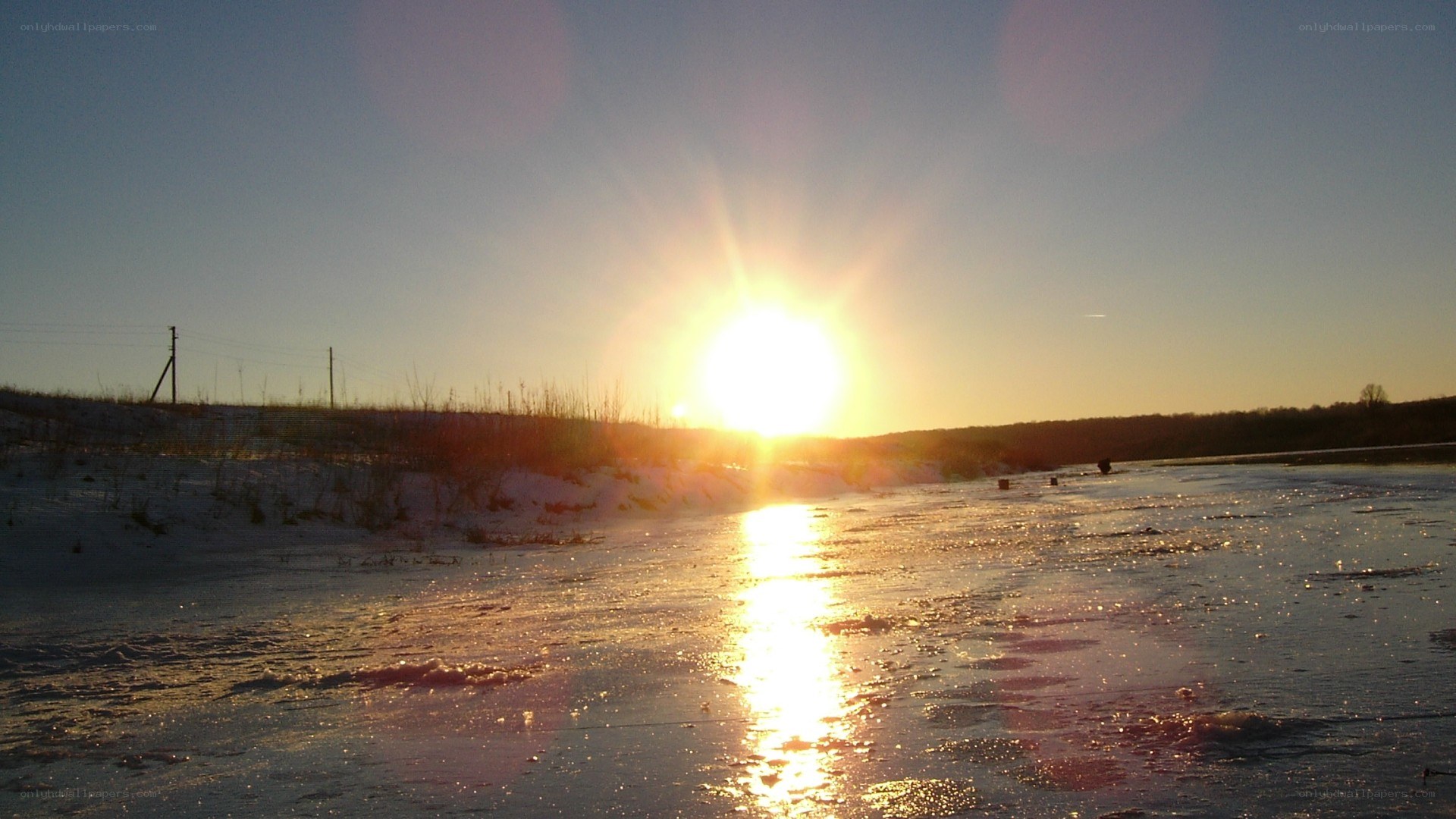 Sunset over a frozen river