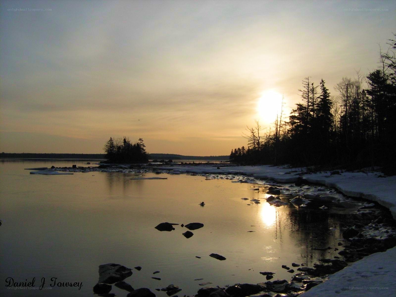 Sunset over a frozen shoreline