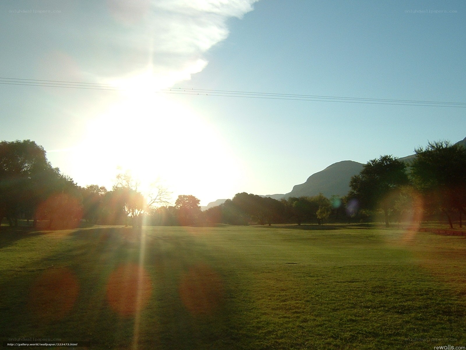 Sunset over a grassy field