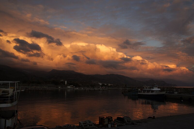 sunset over a harbor