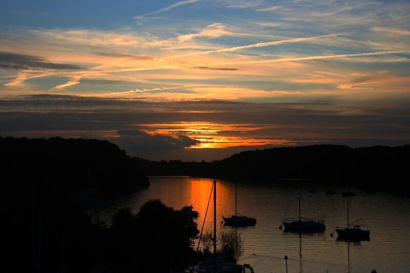 sunset over a harbor