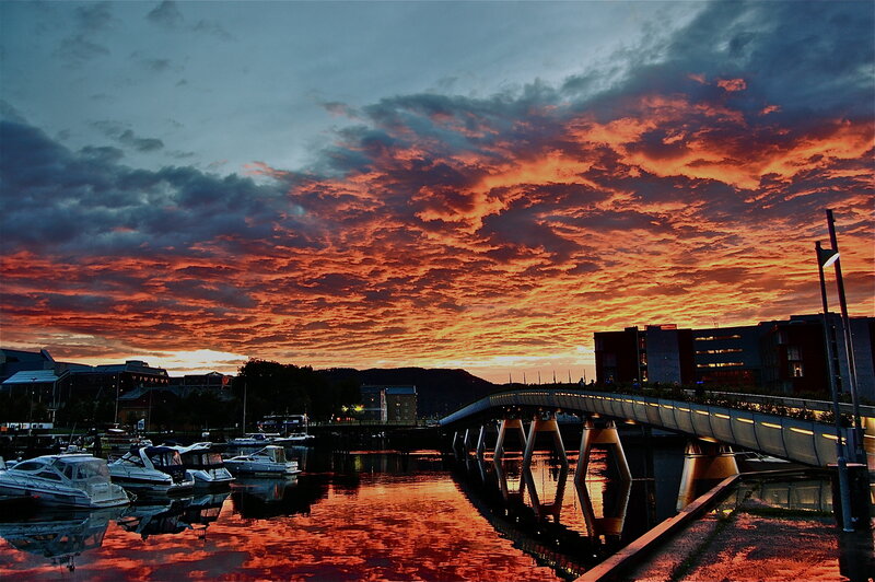 Sunset over a harbor bridge