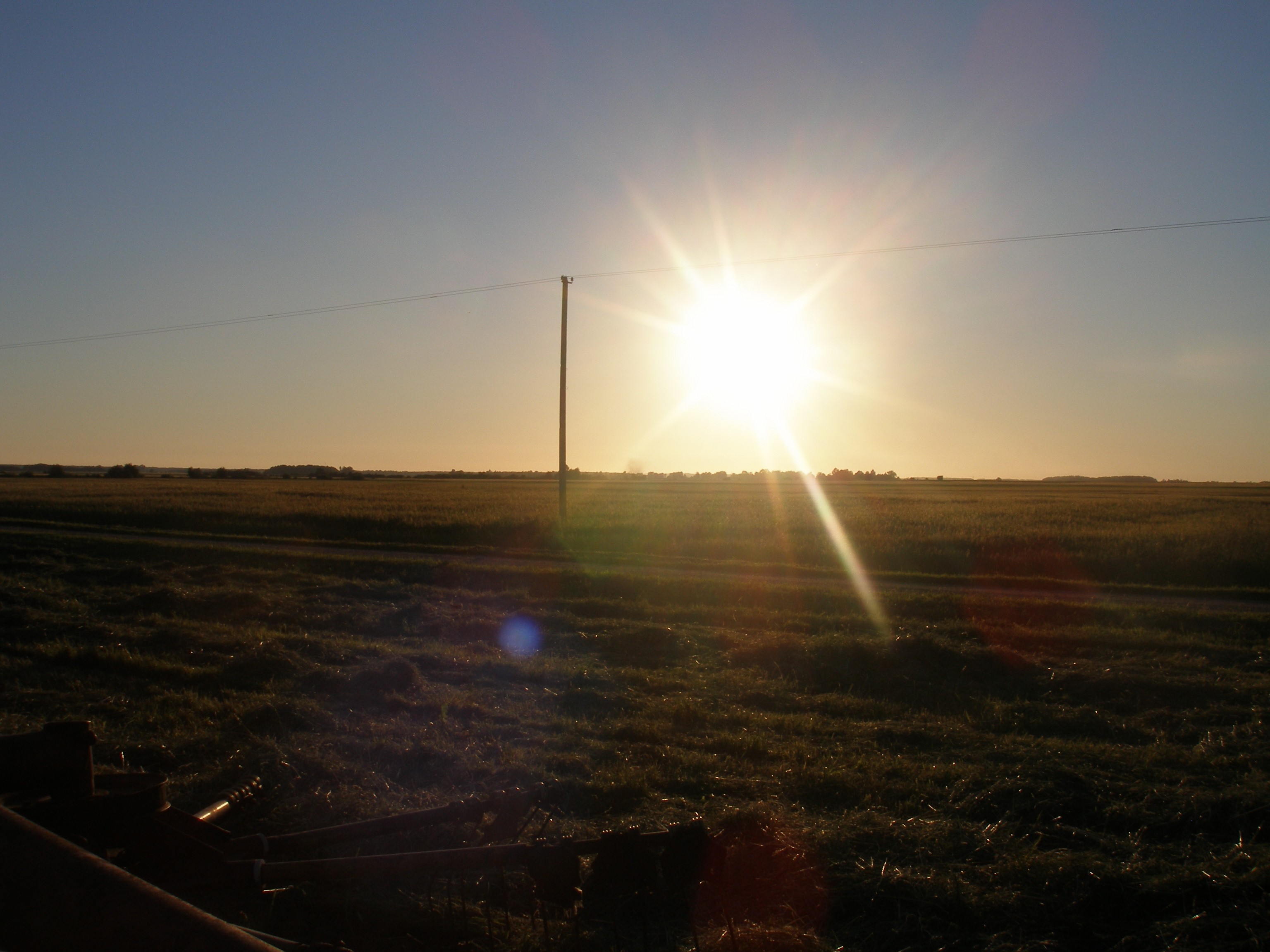 Sunset over a harvested field