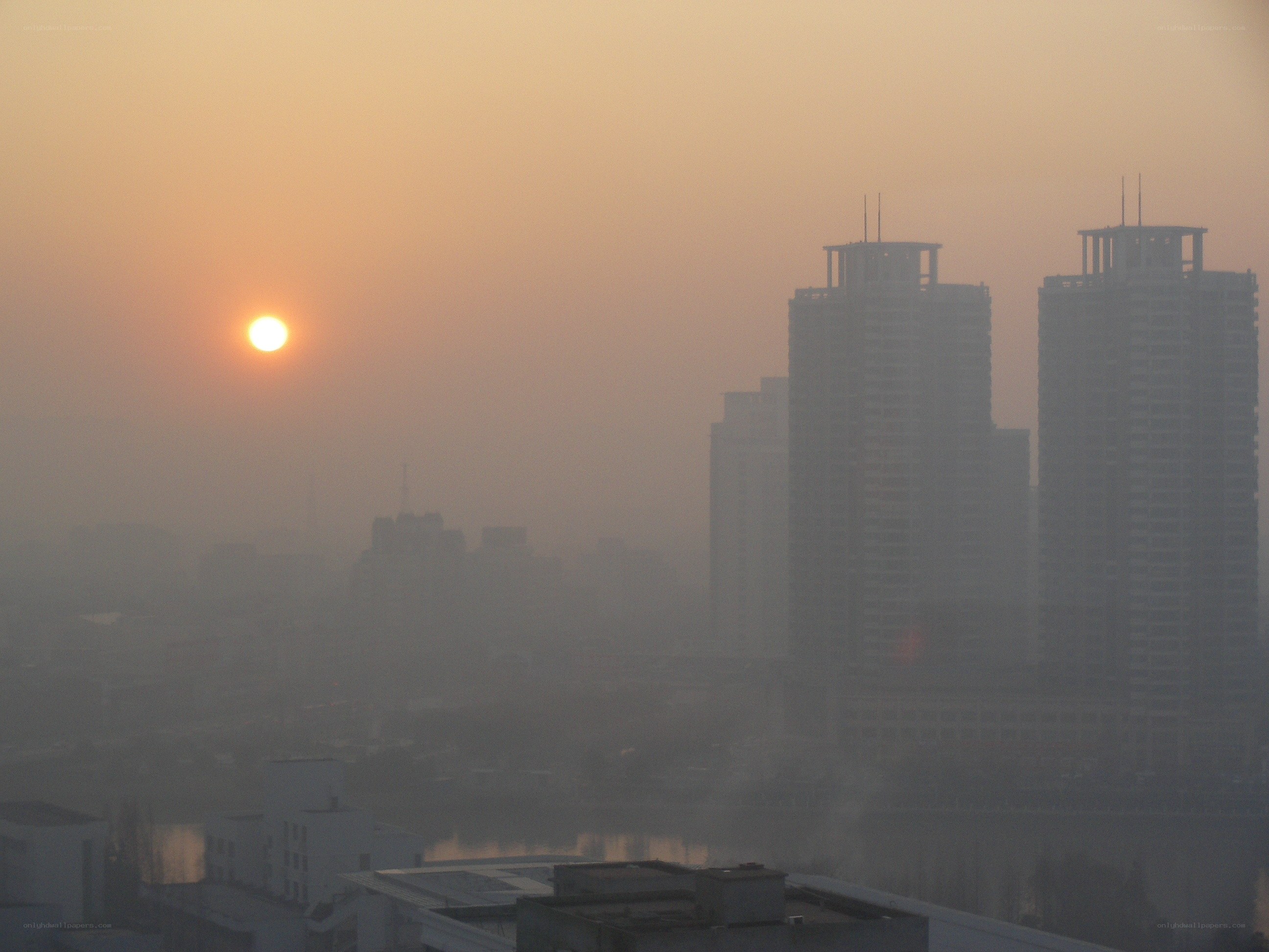 Sunset over a hazy city