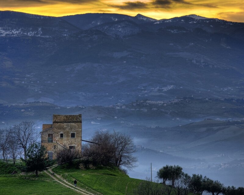 Sunset over a hilltop house