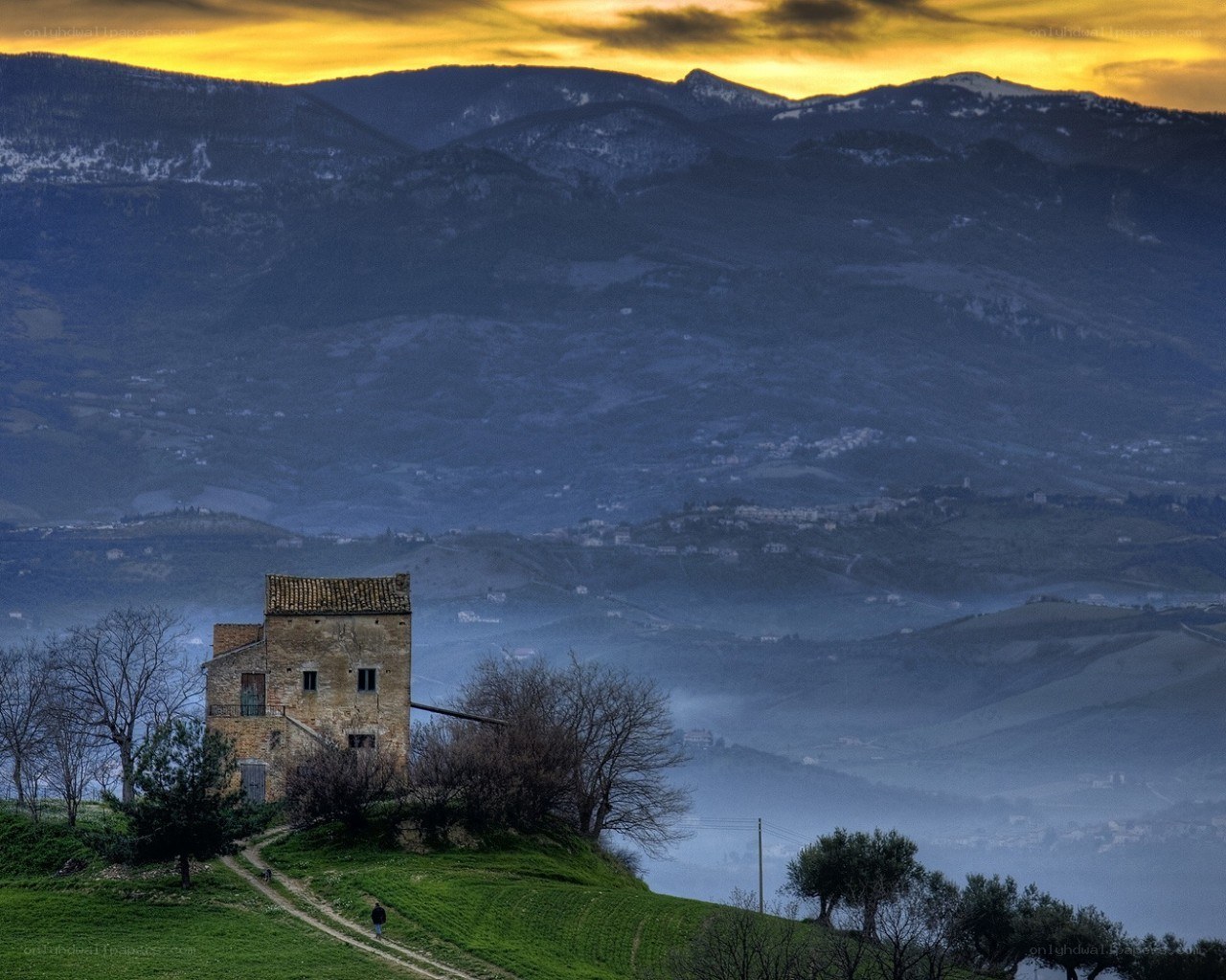 Sunset over a hilltop house