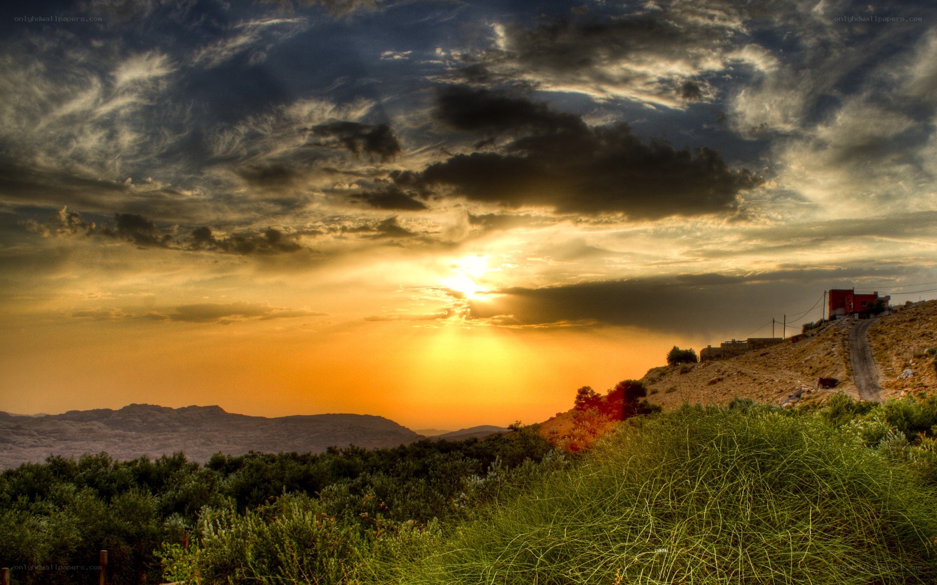 Sunset over a hilly landscape