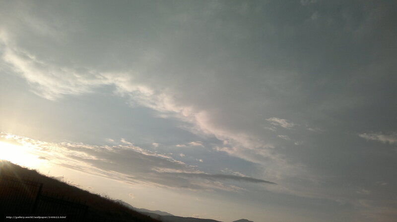 Sunset over a hilly landscape