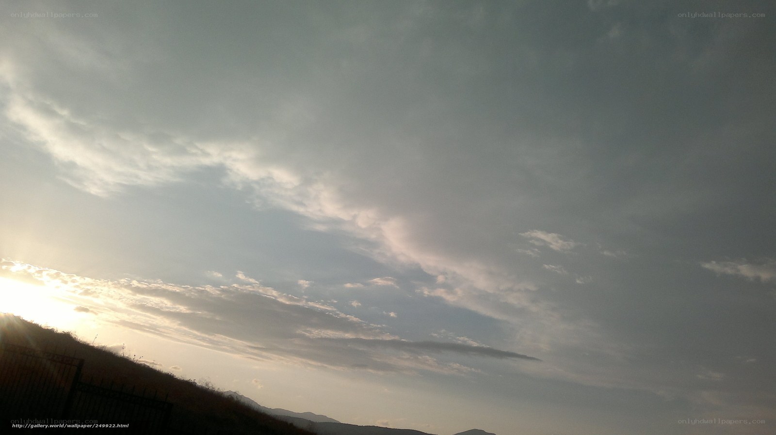 Sunset over a hilly landscape