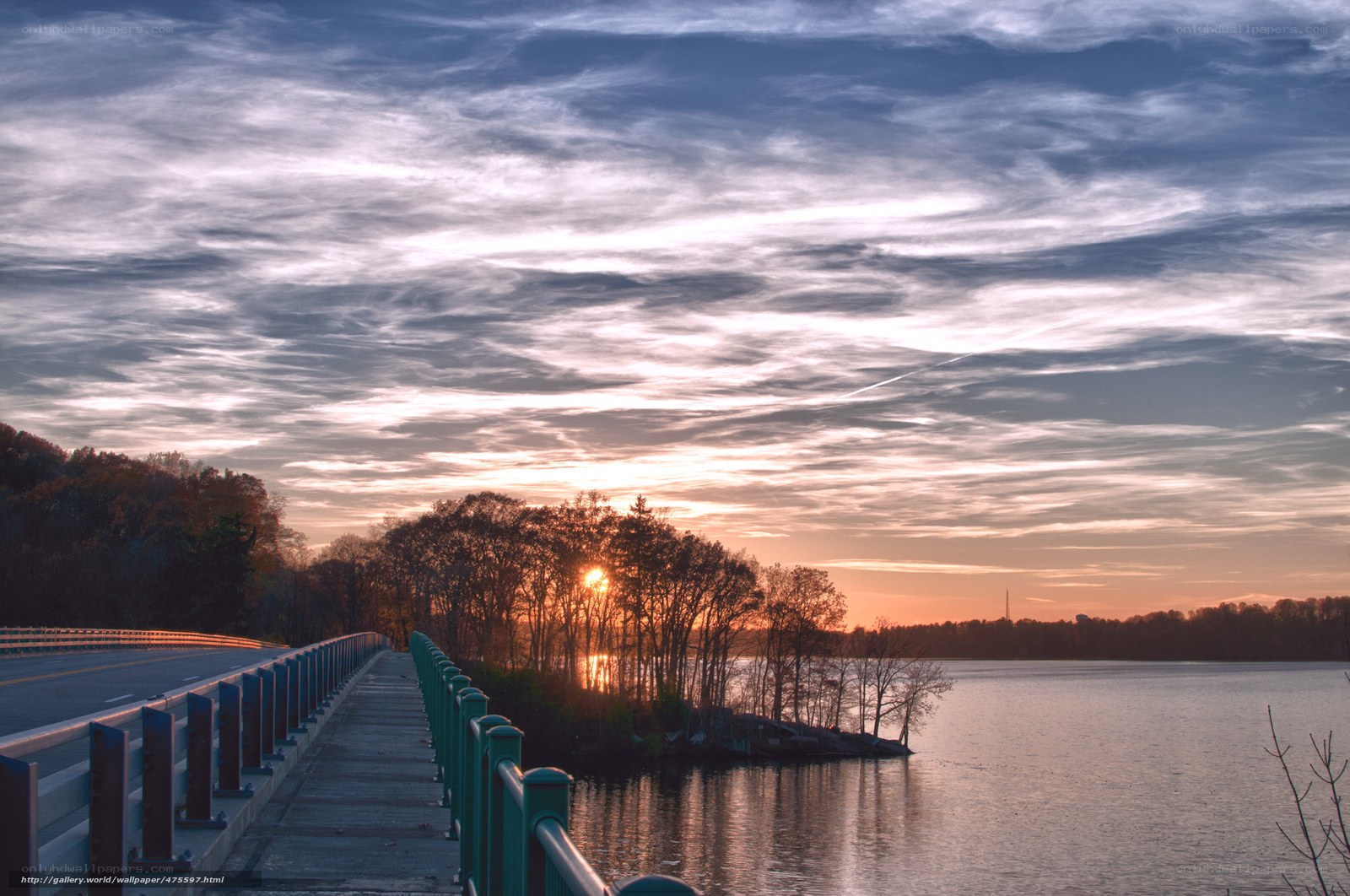 Sunset over a lake and bridge