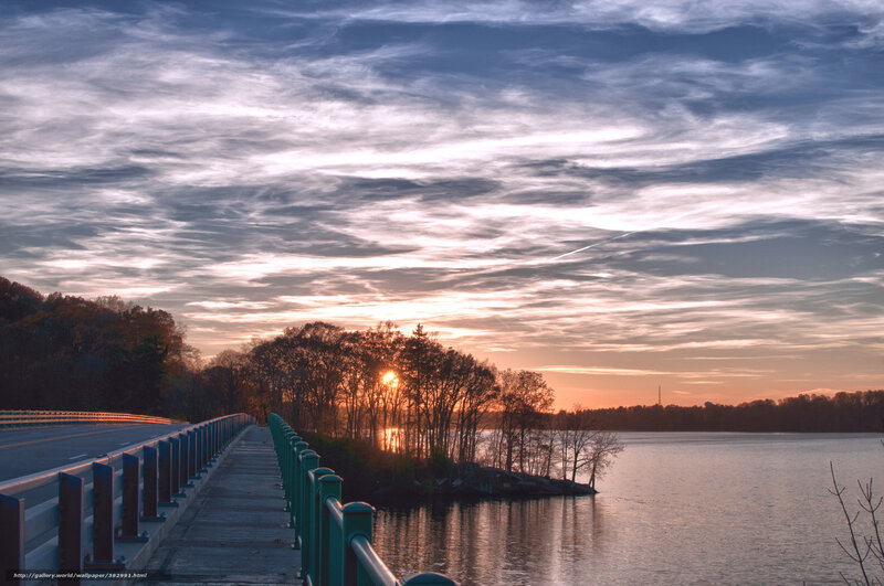 Sunset over a lake and bridge