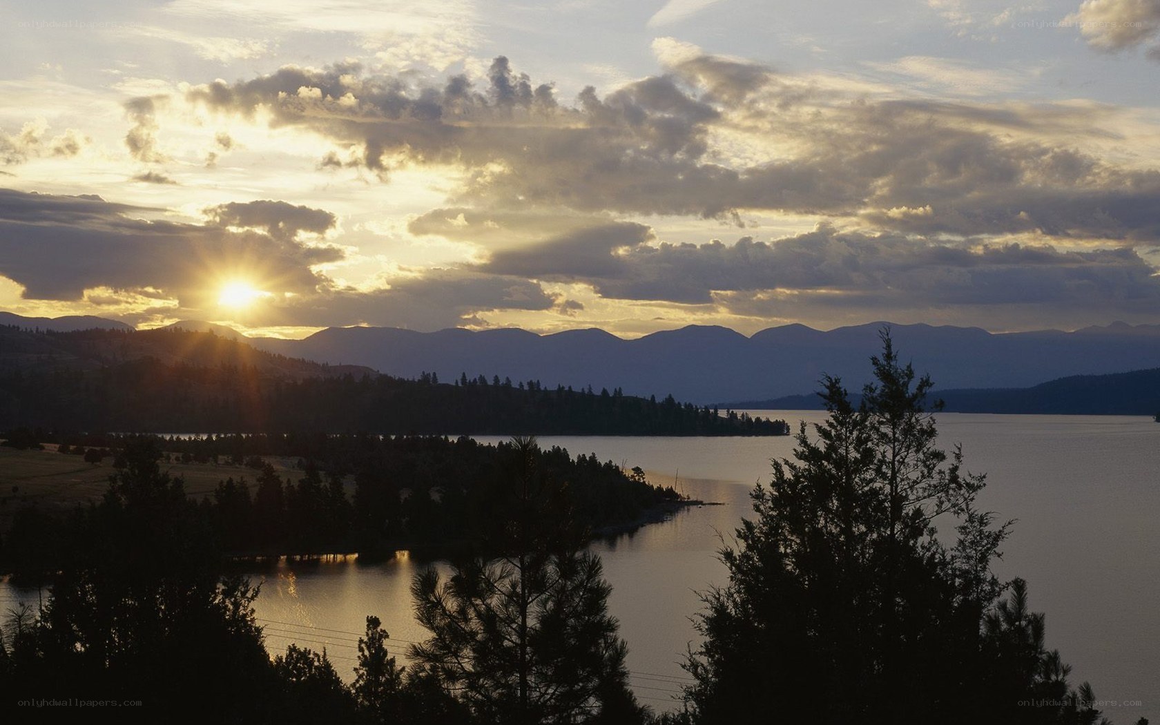 Sunset over a lake and mountains