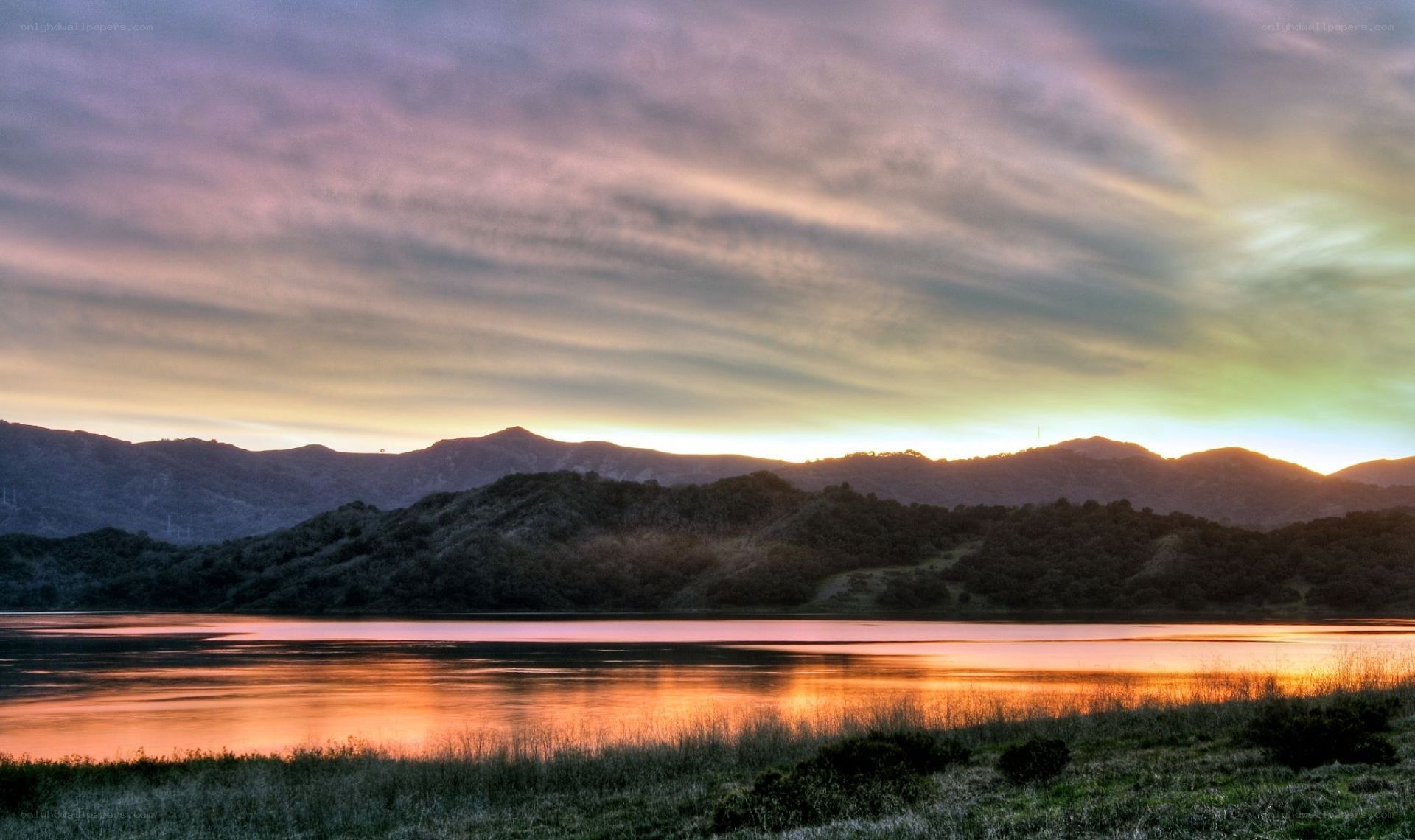 Sunset over a lake and mountains