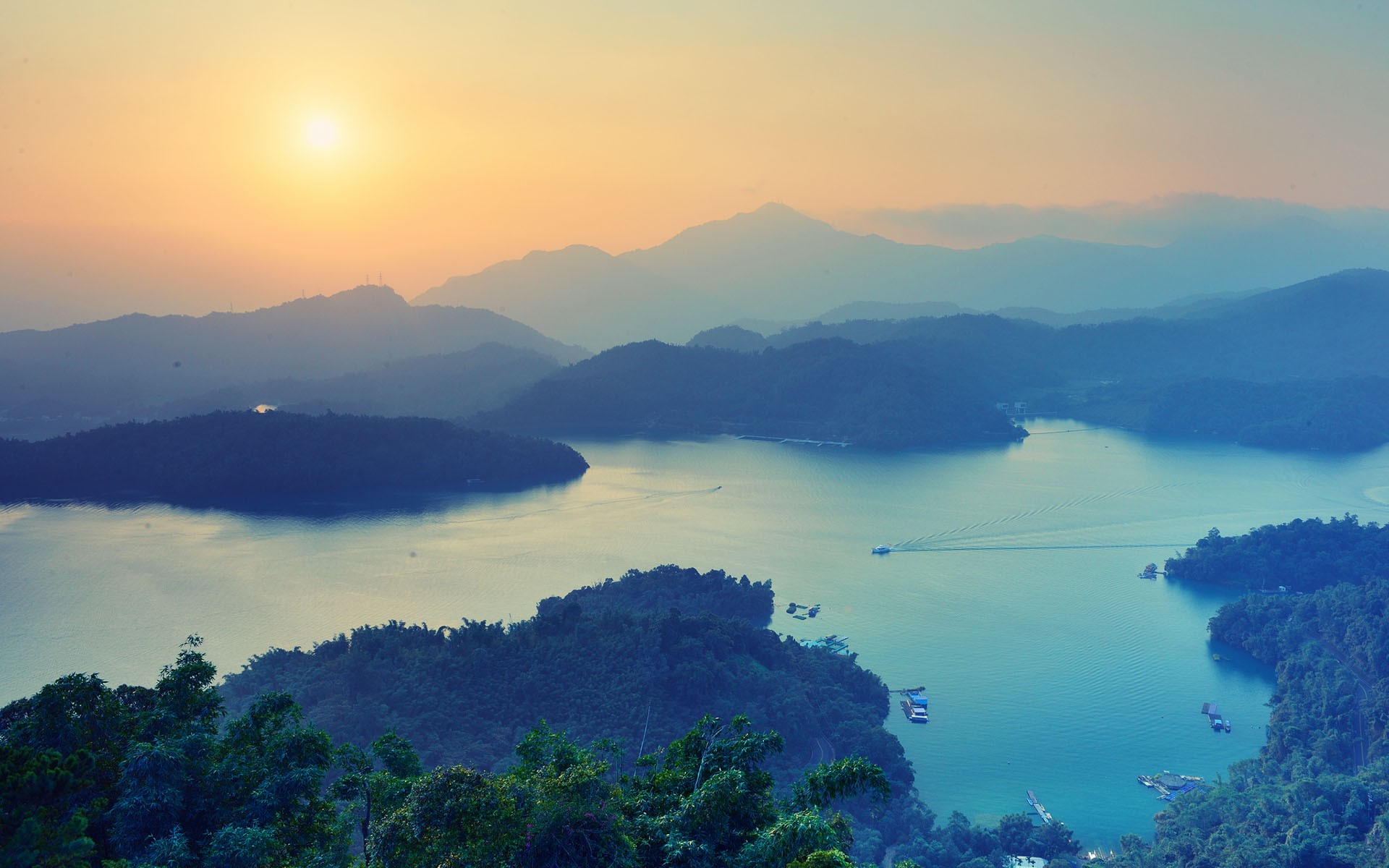 Sunset over a lake and mountains