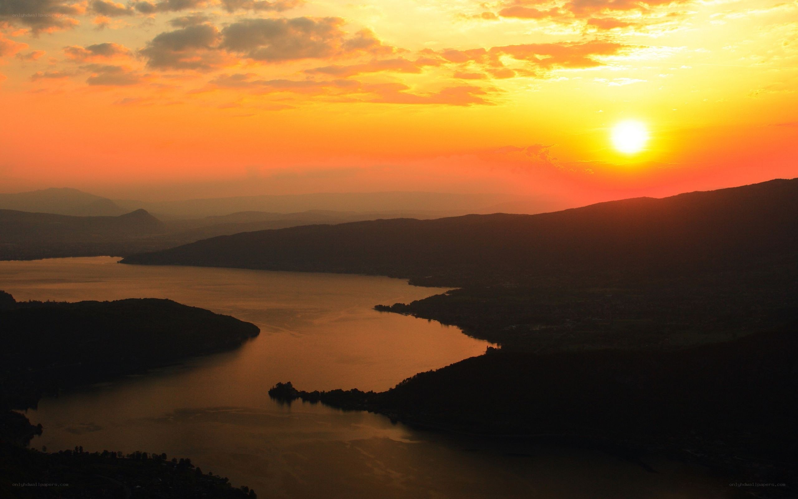 Sunset over a lake and mountains