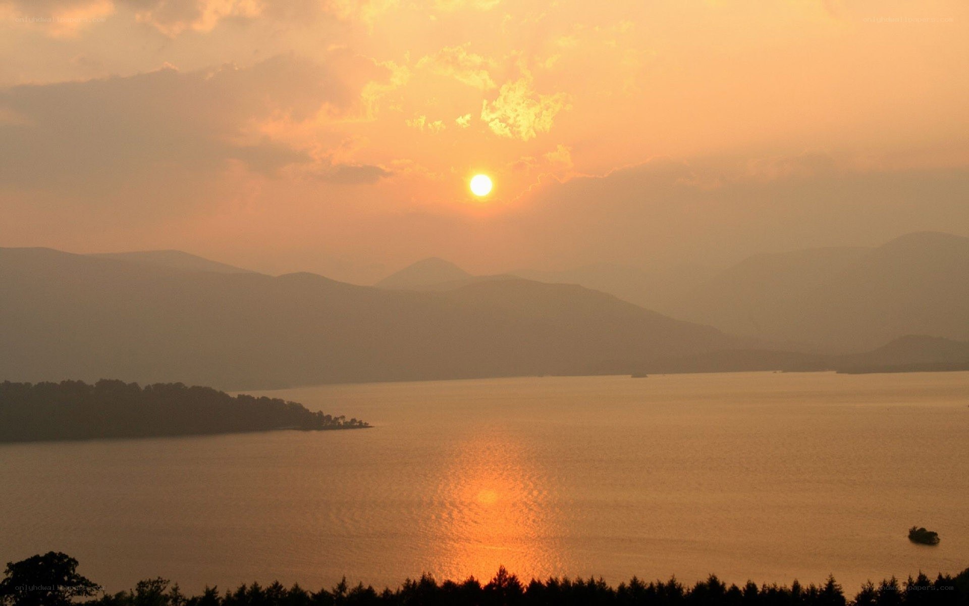 Sunset over a lake and mountains